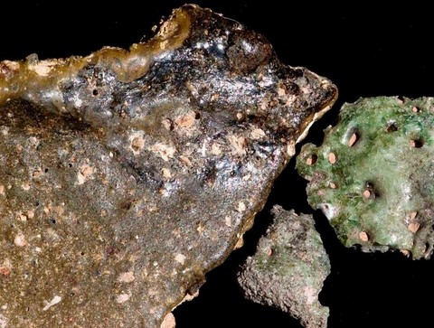 Pottery sherd from Tall el-Hamman glazed by meteoritic explosion, and piece of trinitite from Alamogordo nuclear bomb